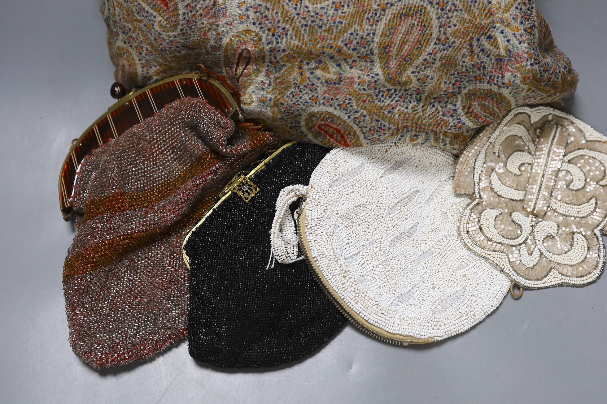 A paisley pattern silk shawl (damaged), together with four beaded evening bags